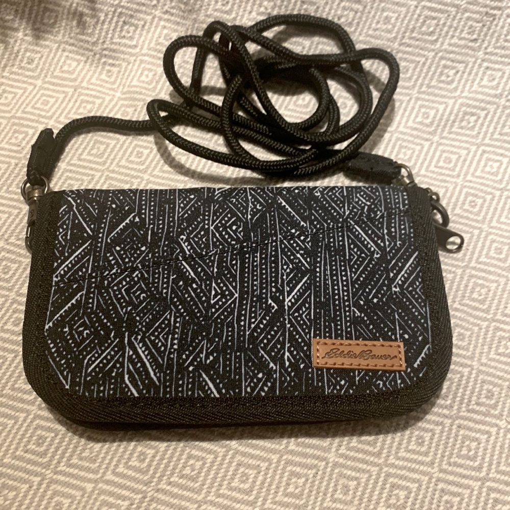 Small Eddie Bauer Purse with a black cord strap. Compartments for cash and cc’s